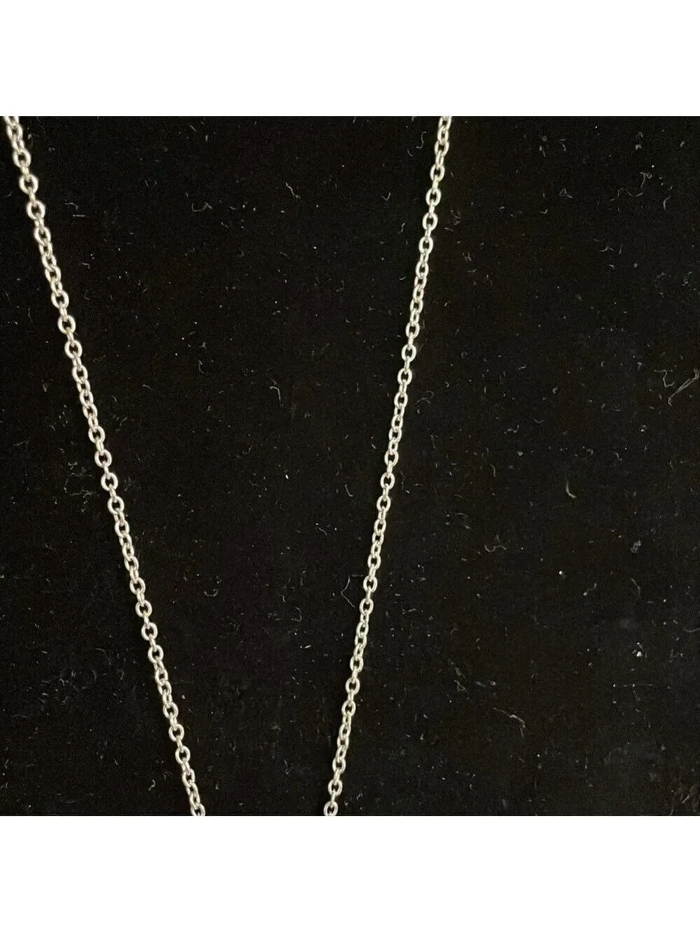 Avon White triple stone pendant with silver tone chain and removable extender